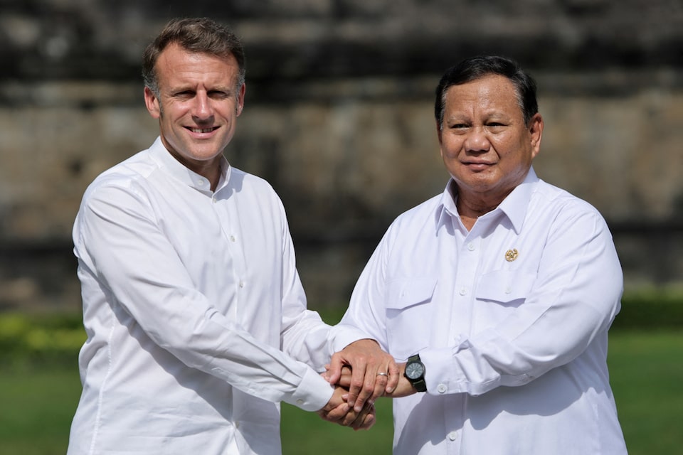 Indonesia's President Prabowo Subianto and France's President Emmanuel Macron pose for photos as they visit Borobudur Temple, the world's largest Buddhist monument and a UNESCO World Heritage Site, in Magelang, Central Java, on May 29, 2025. YASUYOSHI CHIBA/Pool via REUTERS