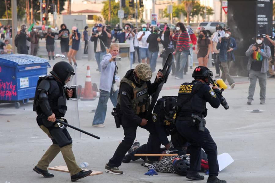 Police detains a protester blocking the garage entrance of the Los Angeles Federal Building following multiple detentions by Immigration and Customs Enforcement (ICE), in downtown Los Angeles, California, US, June 6, 2025.