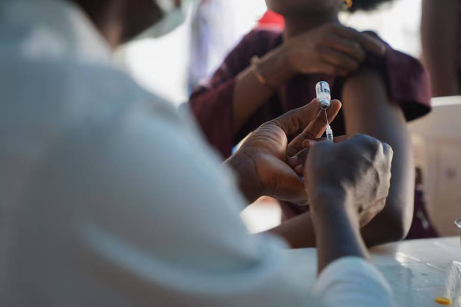 A Nigerian health official prepares to administer a mpox vaccination to a woman, at Federal Medical Center in Abuja, Nigeria November 18, 2024.
