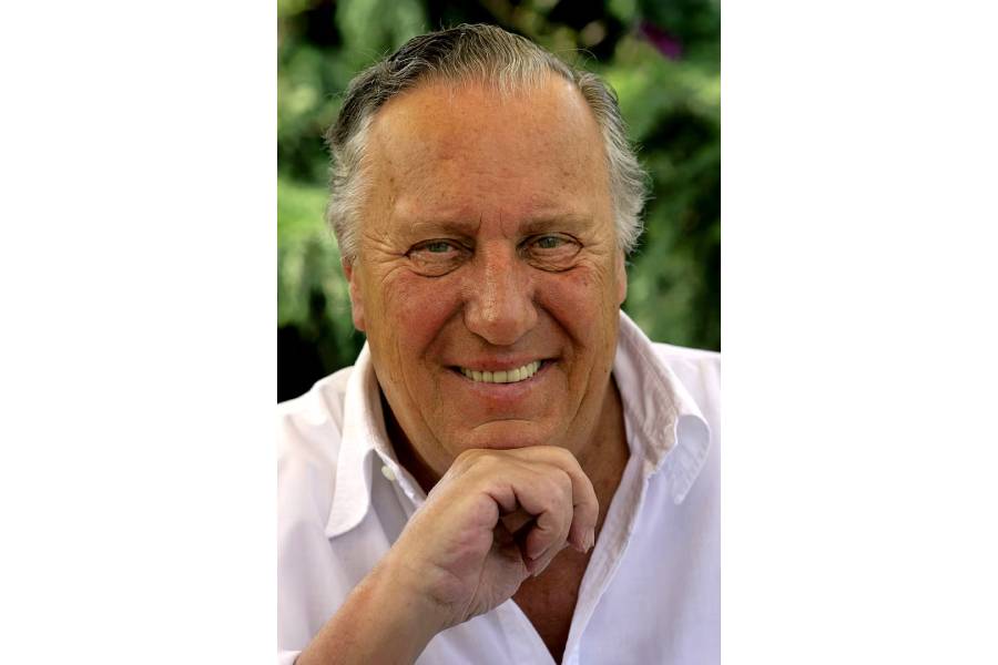 British novelist Frederick Forsyth smiles during an interview with Reuters at his home near Hertford, England, July 26, 2006.