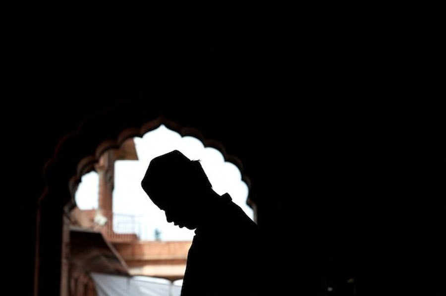 A Muslim man offers prayers during Jumat-ul-Vida, or the last Friday of the holy fasting month of Ramadan, inside Jama Masjid (Grand Mosque) in the old quarters of Delhi, India, April 5, 2024.
