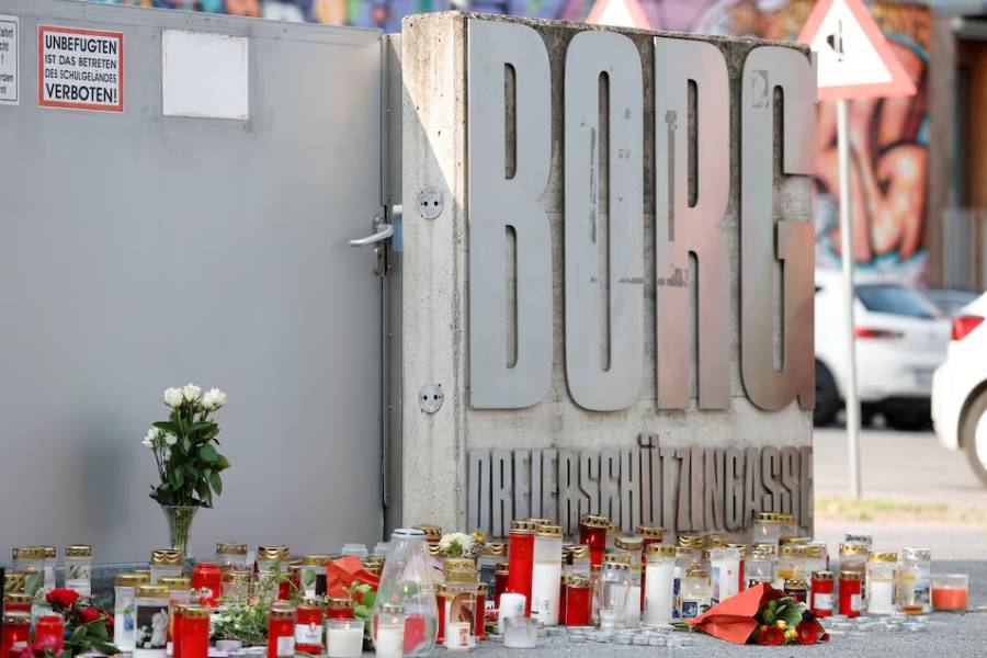 Candles are placed outside a secondary school following a deadly shooting, in Graz, Austria, June 11, 2025.