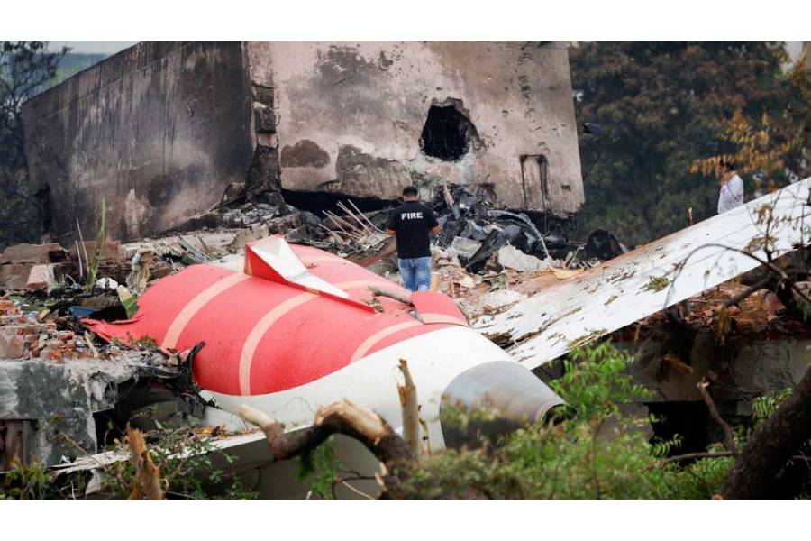 A fire officer stands next to the crashed Air India Boeing 787-8 Dreamliner aircraft, in Ahmedabad, India, June 13, 2025.