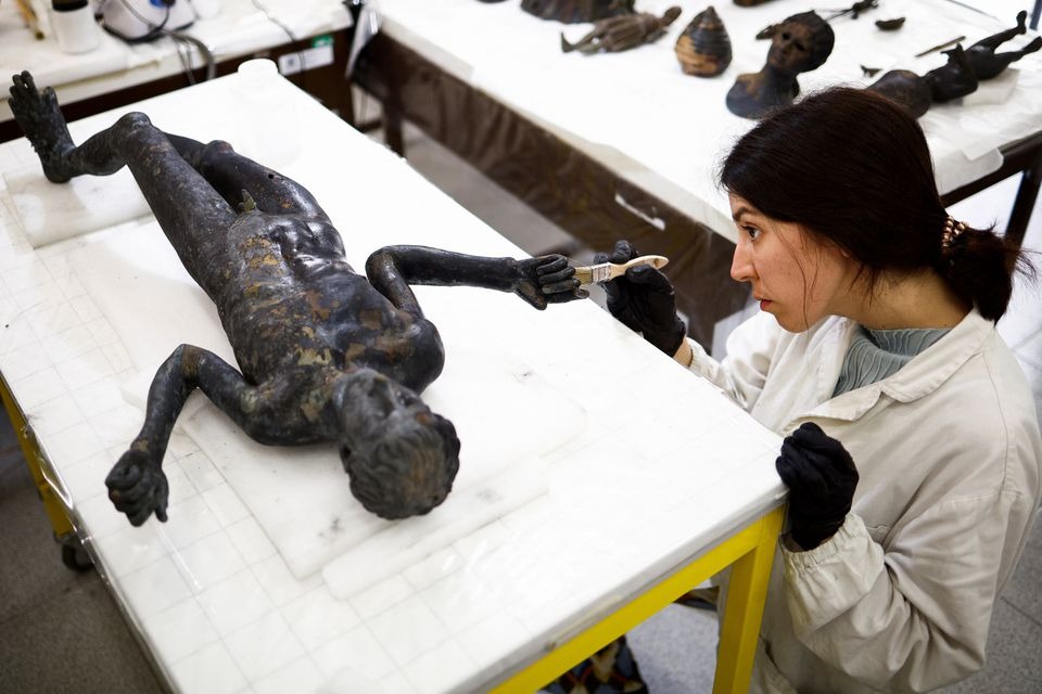 Garbage man helped unearth ancient bronze statues in Italy's Tuscany