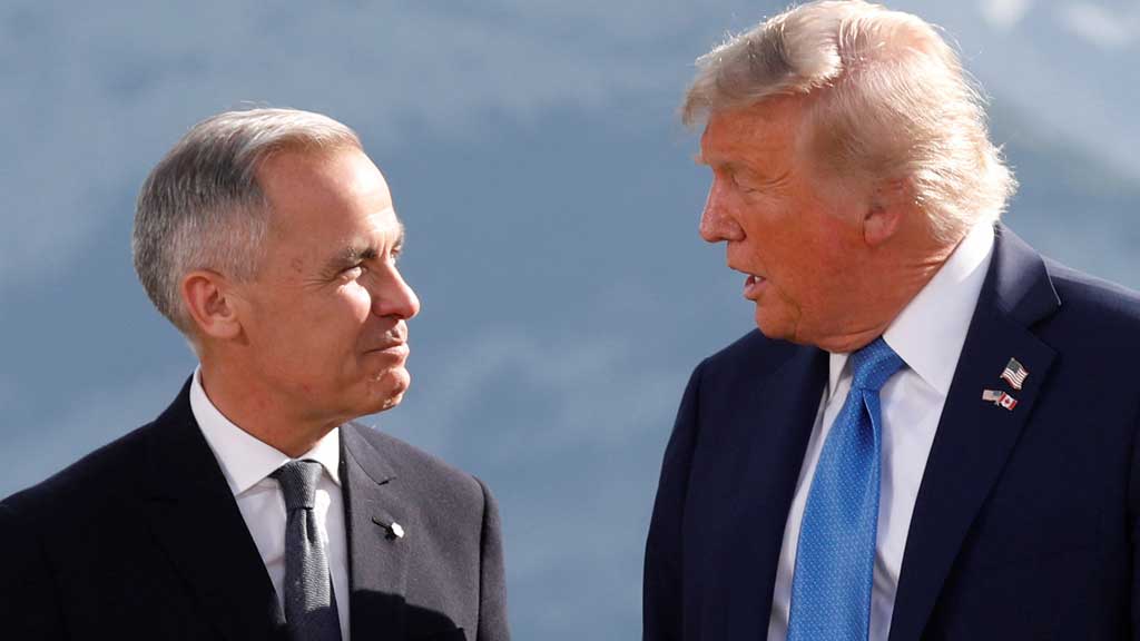 US President Donald Trump and Canada's Prime Minister Mark Carney talk during a family photo at the G7 Summit in Kananaskis, Alberta, Canada, Jun 16, 2025. REUTERS