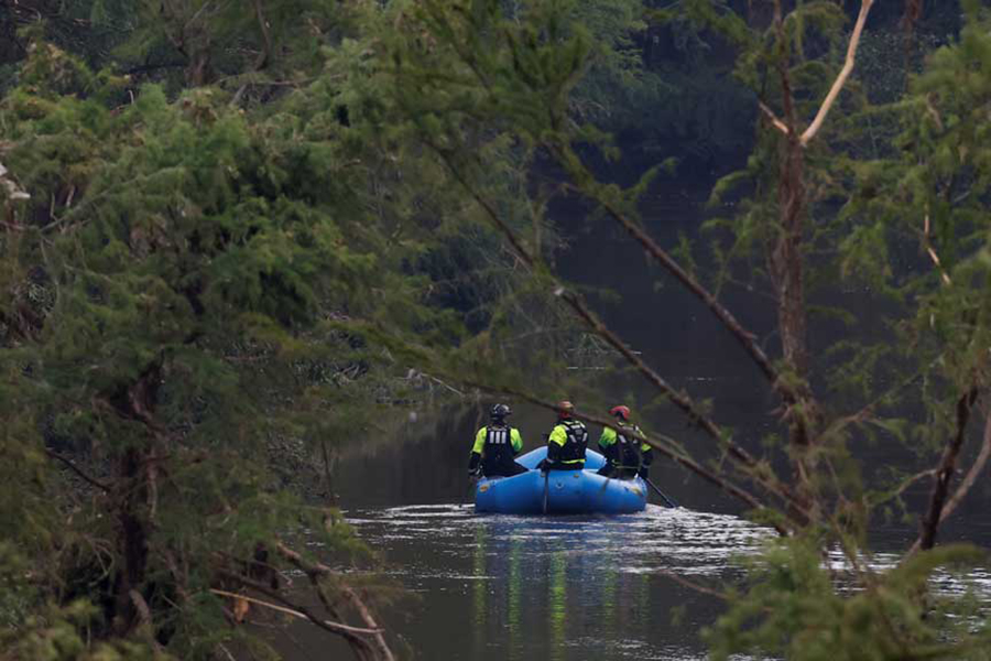 Rescuers paddle an inflatable boat as they search along a waterway following flash flooding, in Kerrville, Texas, US on July 6, 2025 — Reuters photo