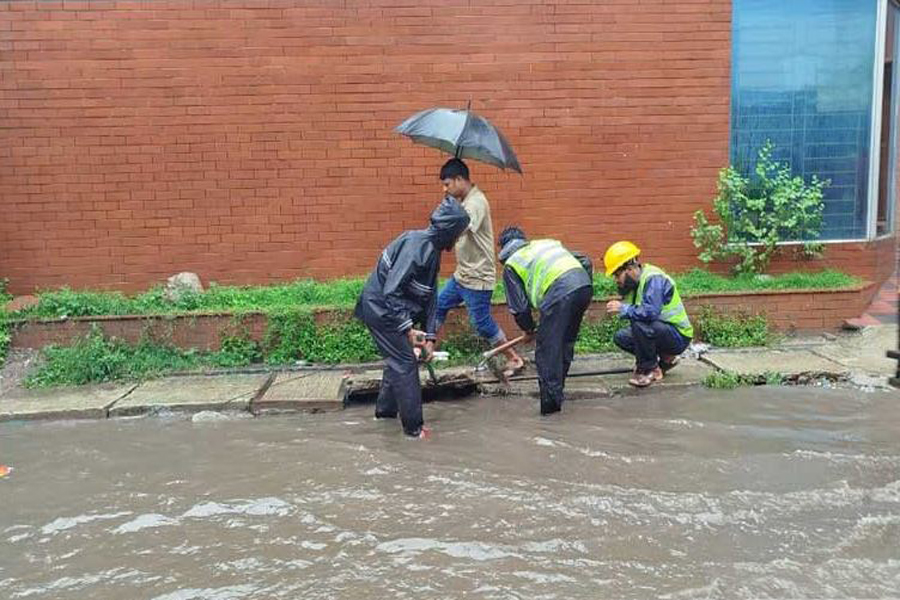 Heavy rain disrupts daily life in Dhaka
