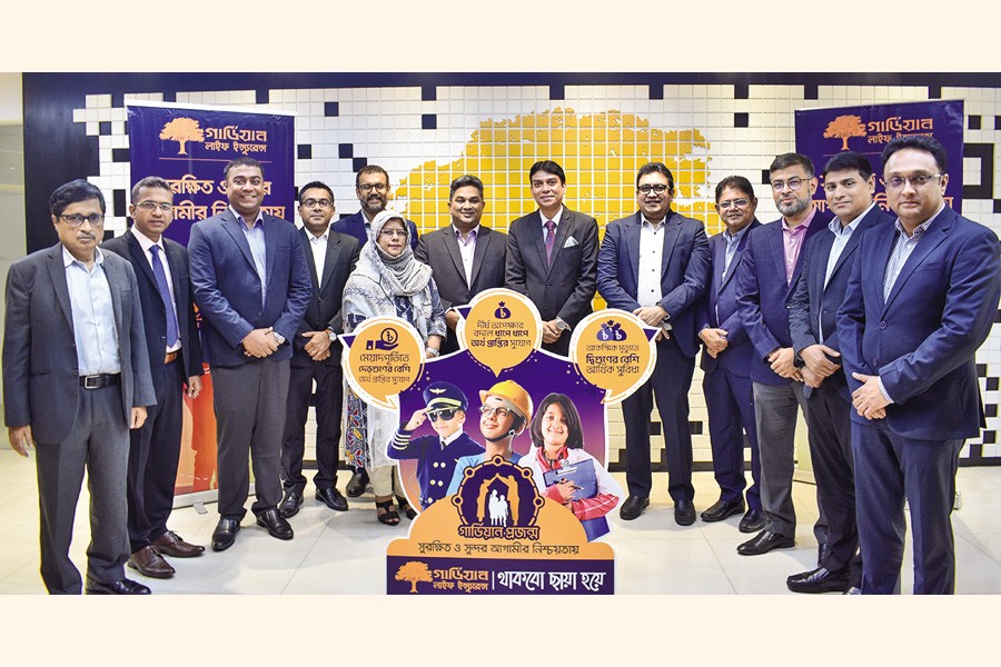Chief Executive Officer of Guardian Life Insurance Limited Sheikh Rakibul Karim and other senior officials pose at the launching ceremony of 'Guardian Projonmo', a child protection plan, at the company's Head Office in Dhaka recently.
