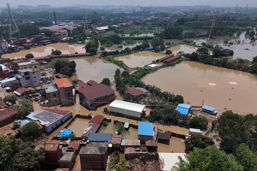 A drone view shows flooded houses and fish farms after days of heavy rainfall, in Qingyuan, Guangdong province, China August 8, 2025.