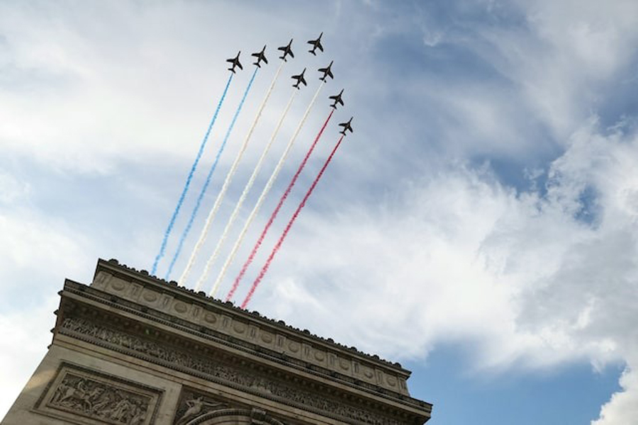 Alpha Jets of the French Air Force Elite aerobatic flying team "Patrouille de France", perform a fly-over during a ceremony at the Arc de Triomphe for the 80th anniversary of VE Day, or Victory in Europe Day, marking the end of World War II in Europe, in Paris, France May 8, 2025.