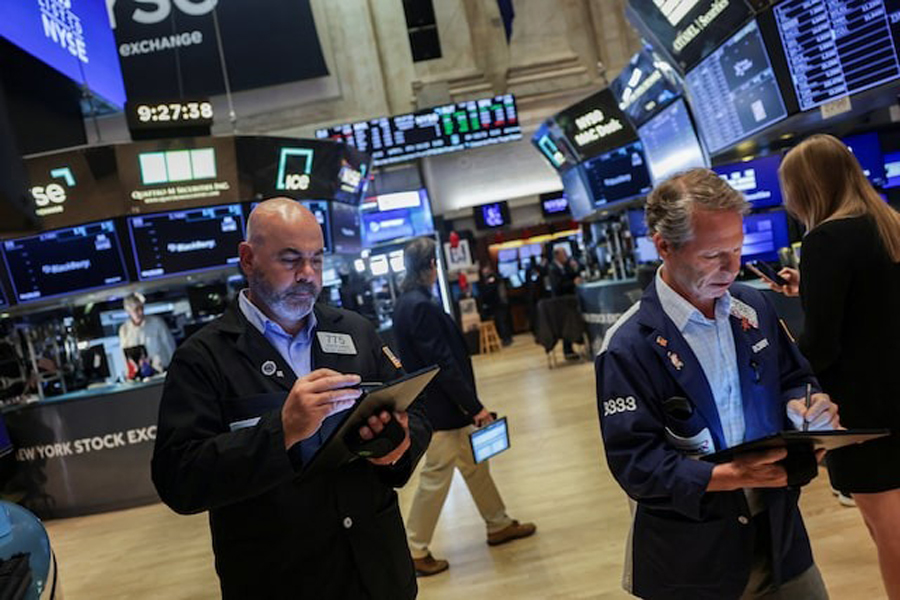 Traders work on the floor at the New York Stock Exchange (NYSE) in New York City, US, August 6, 2025.
