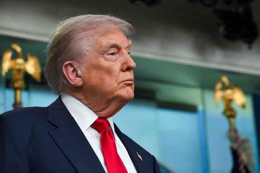 US President Donald Trump looks on as he speaks to the press in the Press Briefing Room at the White House in Washington, DC, US, August 11, 2025.