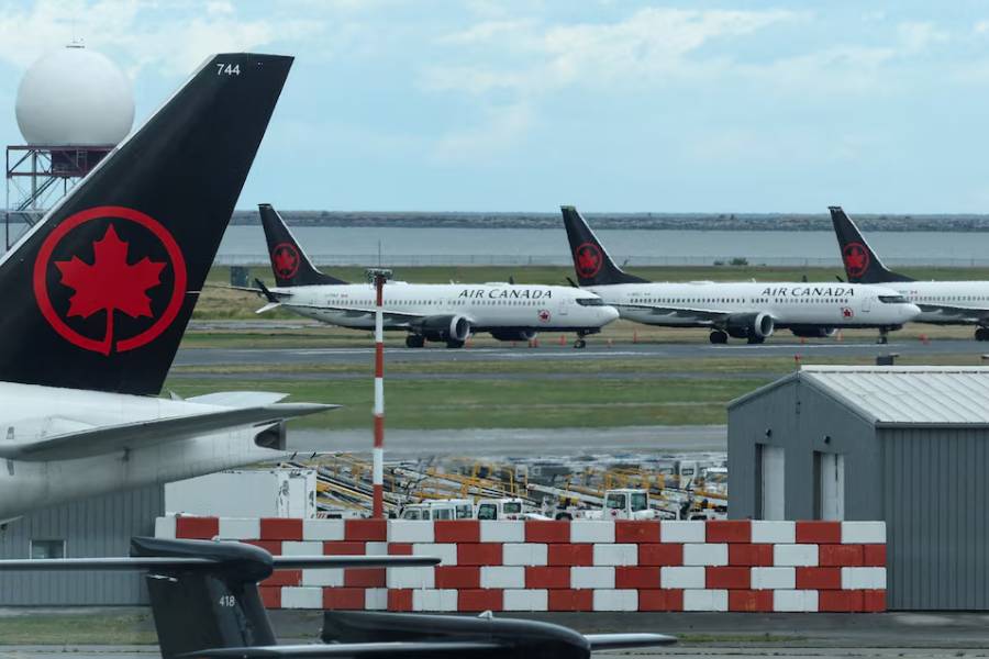 Air Canada planes stand on the tarmac at Vancouver International Airport in Richmond, British Columbia, Canada August 16, 2025.