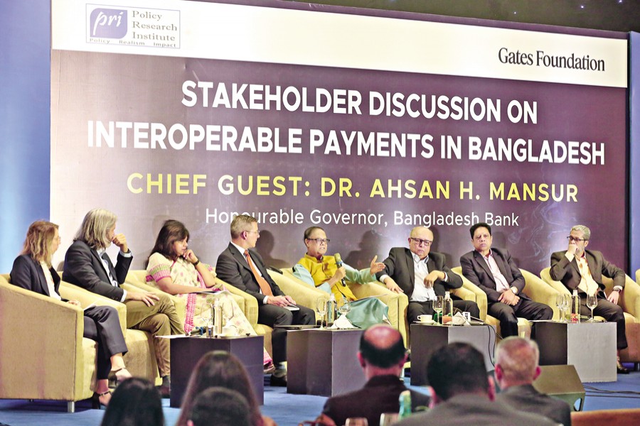 Bangladesh Bank Governor Dr Ahsan H. Mansur speaks at a discussion on 'Interoperable Payments in Bangladesh' organised by the Policy Research Institute with support from the Gates Foundation, at a city hotel on Monday. — FE Photo