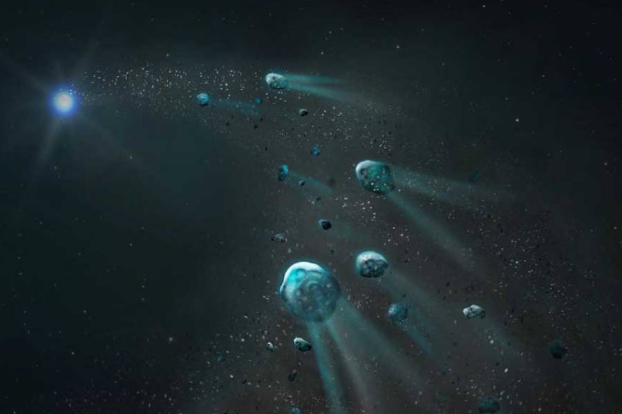 An early stage of an icy body being torn apart by the intense gravity of a white dwarf -a highly compact stellar ember- leaving glowing trails of gas and dust, as its fragments spiral inward, is seen in this handout illustration released on Sept 24, 2025.