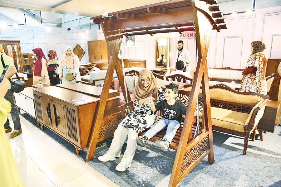 Visitors explore the latest furniture designs at a fair at the International Convention City Bashundhara (ICCB) in the city on Friday. — FE Photo