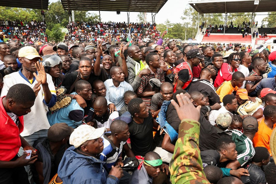 People gather to view the coffin of Kenya's former Prime Minister Raila Odinga during his funeral service at the Jomo Kenyatta Stadium in Mamboleo, in Kisumu County, Kenya, October 18, 2025.
