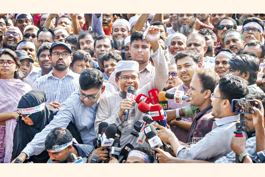 MPO-listed teachers are all smiles at Central Shaheed Minar in Dhaka on Tuesday as the government accepted their demand for raising house rent. — bdnews24.com