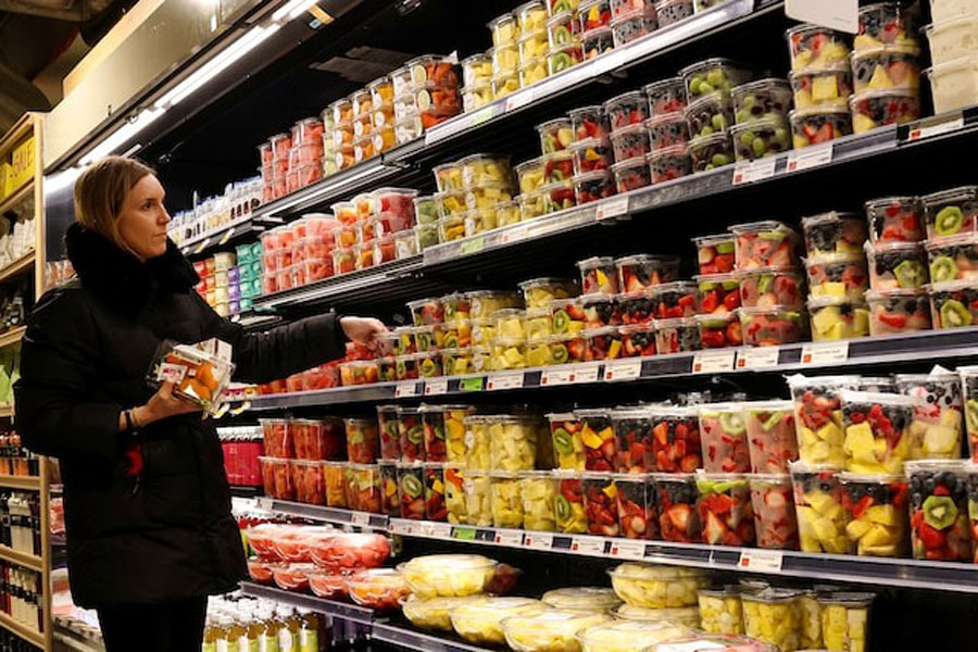 A woman shops for fruit in a store in New York City, US, February 12, 2025.