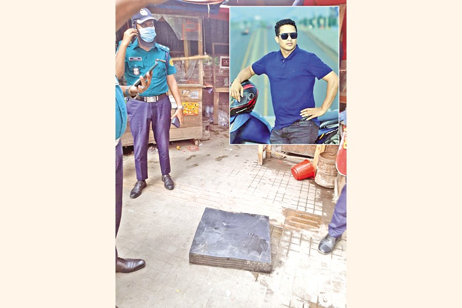 A pedestrian by the name of Abul Kalam, 35, (inset) died as a bearing pad from the Dhaka Metro Rail line fell on him at Farmgate on Sunday. Policemen are seen standing next to the bearing pad. — FE Photo