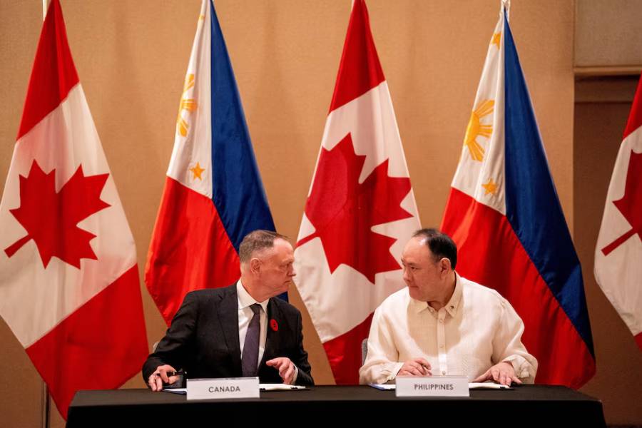 Canada's Defence Minister David McGuinty and his Philippine counterpart Gilberto Teodoro Jr prepare to sign the Philippines-Canada Status of Visiting Forces Agreement (SOVFA), in Makati City, Metro Manila, Philippines, November 2, 2025.