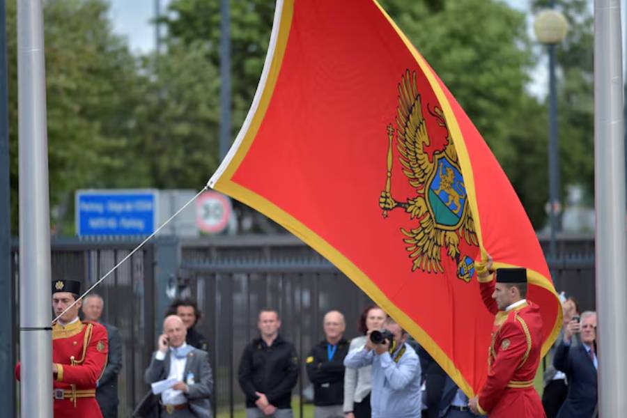 Flag of Montenegro is raised during a ceremony to mark the accession to NATO of Montenegro at NATO headquarters in Brussels, Belgium June 7, 2017.