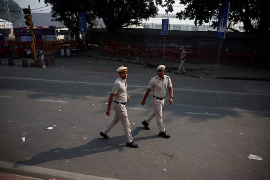 Police officers patrol near the site of Monday’s deadly car blast, in front of the historic Red Fort in the old quarters of Delhi, India, November 12, 2025.
