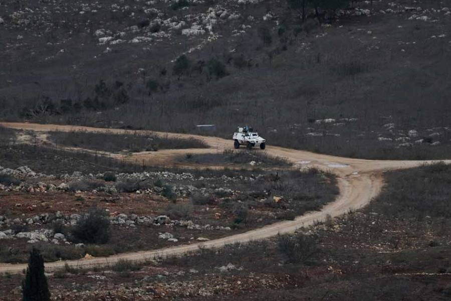 A UN vehicle drives near a concrete wall along Lebanon’s southern border which, according to the Lebanese presidency, extends beyond the “Blue Line”, a UN-mapped line separating Lebanon from Israel and the Israeli-occupied Golan Heights, as seen from northern Israel, Nov 16, 2025.
