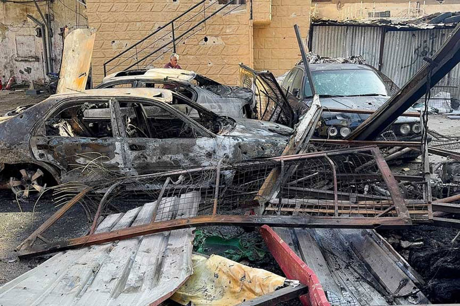 Damaged cars stand at the site of the Israeli strike that killed several people yesterday night, according to the Lebanese Health Ministry, inside the Ain al-Hilweh Palestinian refugee camp in the southern city of Sidon, Lebanon, Nov 19, 2025.