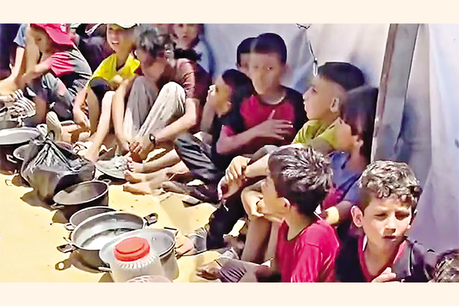 - Children wait for food by community kitchen in Gaza