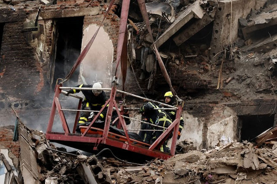 Emergency responders work to retrieve the bodies of residents who were killed when a Russian missile hit an apartment building on Wednesday, amid Russia's attack on Ukraine, in Ternopil, Ukraine, November 21, 2025.