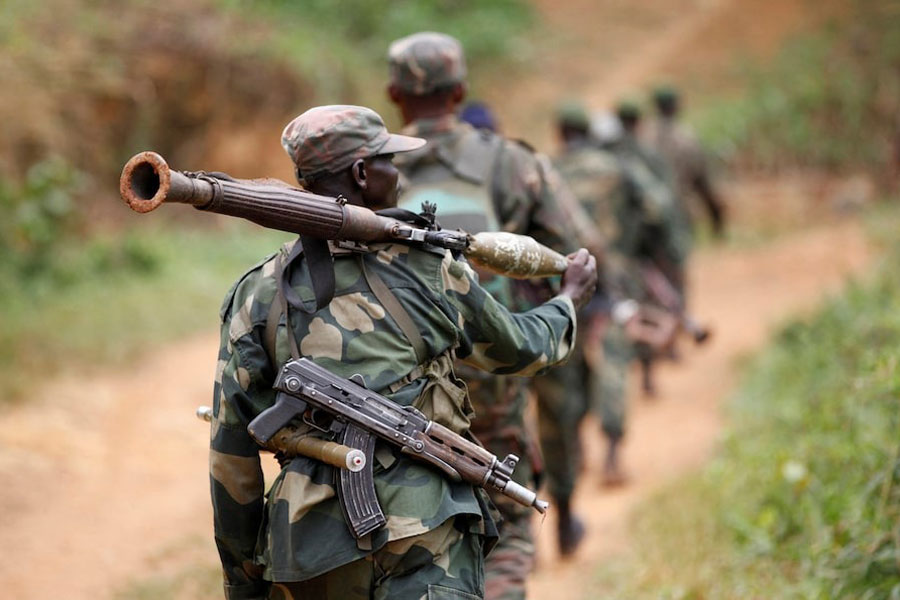 Democratic Republic of Congo military personnel (FARDC) patrol against the Allied Democratic Forces (ADF) and the National Army for the Liberation of Uganda (NALU) rebels near Beni in North-Kivu province, December 31, 2013. The Democratic Republic of Congo is struggling to emerge from decades of violence and instability, particularly in its east, in which millions of people have died, mostly from hunger and disease. A 21,000-strong United Nations peacekeeping mission (MONUSCO) is stationed in the country.