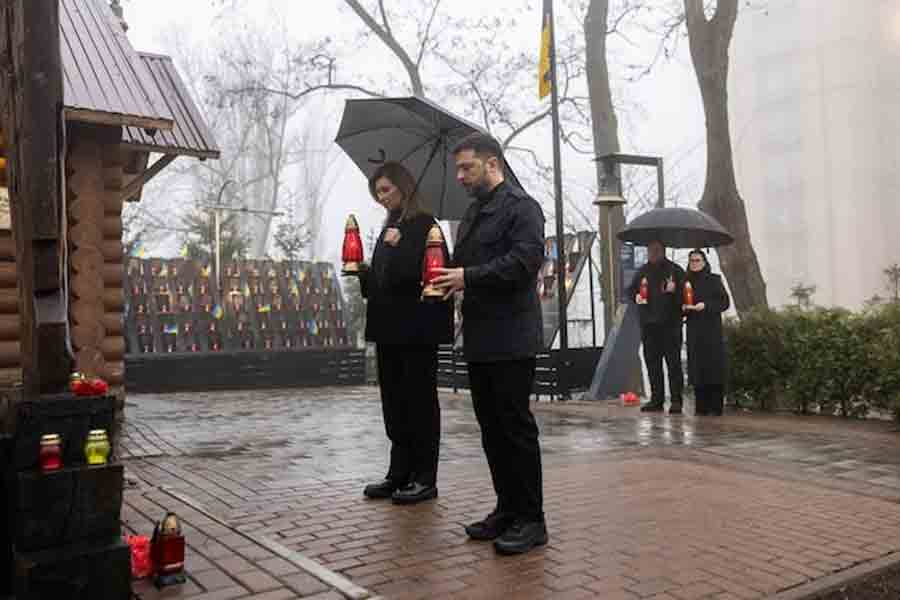 Ukraine's President Volodymyr Zelenskiy and his wife Olena attend a commemoration ceremony at a monument to the so-called "Heavenly Hundred", the people killed during the Ukrainian pro-European Union (EU) mass demonstrations in 2014, to mark the 12th anniversary of the start of the uprising, amid Russia's attack on Ukraine, in Kyiv, Ukraine November 21, 2025.