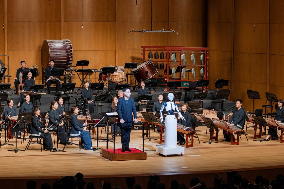 An android robot, EveR 6, is seen as it takes the conductor's podium to lead a performance by South Korea's national orchestra with human conductor Choi Soo-yeoul, in Seoul, South Korea on June 30, 2023, in this handout picture — National Theater of Korea/Handout via REUTERS