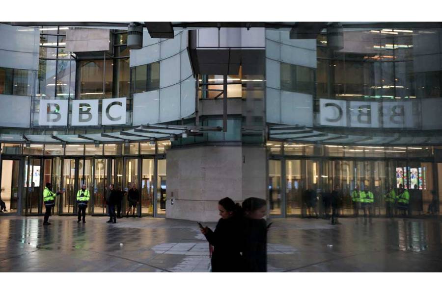 People stand outside BBC Broadcasting House, after Director General Tim Davie and CEO of BBC News Deborah Turness resigned on Sunday, Nov 9, following accusations of bias at the British broadcaster, including in the way it edited a speech by US President Donald Trump, in London, Britain, Nov 14, 2025.