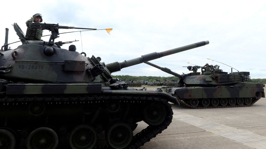 FILE PHOTO: A CM-11 Brave Tiger tank and an M1A2T Abrams tank take part in a commissioning ceremony for Taiwan's first battalion of M1A2T Abrams tanks, at the Hukou military base in Hsinchu, Taiwan October 31, 2025. REUTERS