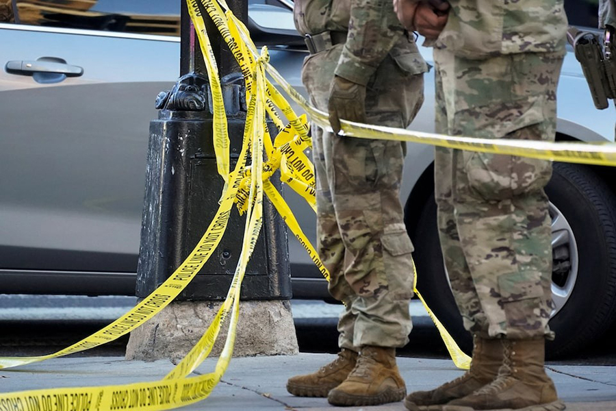 National Guard members stand together behind yellow tape, after two National Guard members were shot near the White House in Washington, DC, US on November 26, 2025 — Reuters photo