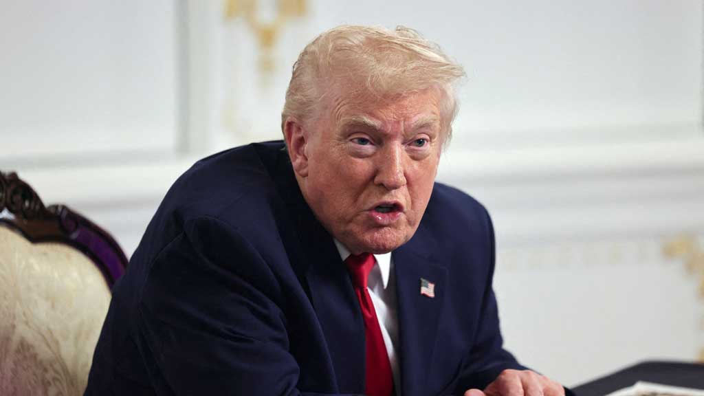 US President Donald Trump speaks with members of the media following a call with military service members, on Thanksgiving, in Palm Beach, Florida, US, Nov 27, 2025. REUTERS/Anna Rose Layden