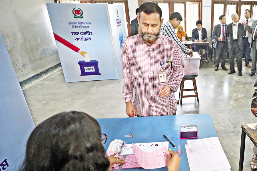 People from different social strata take part in a mock election ahead of the 13th general election at Sher-e-Bangla Nagar Government Girls' High School in the city on Saturday. — FE Photo