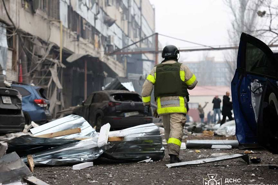 A rescuer walks at the site of a midday Russian missile strike, amid Russia's attack on Ukraine, in Dnipro, Ukraine Dec 1, 2025.