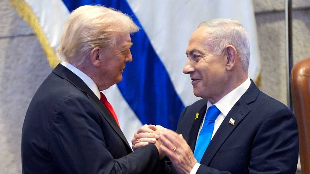 President Donald Trump talks with Israel's Prime Minister Benjamin Netanyahu at the Knesset, Monday, Oct. 13, 2025, in Jerusalem. Evan Vucci/Pool via REUTERS