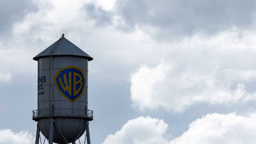 FILE PHOTO: The Warner Bros. studios water tower stands under a stormy sky in Burbank, California, U.S. November 18, 2025. REUTERS TM+Business