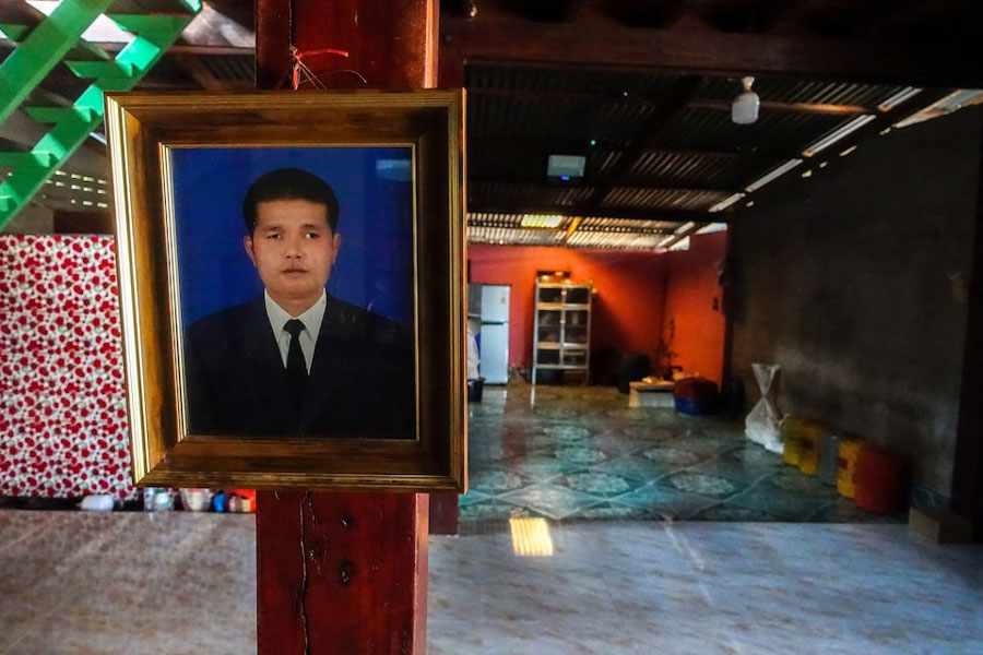 A picture of deceased Thai hostage Sudthisak Rinthalak, who was kidnapped to Gaza in the deadly October 7, 2023, attack by Hamas, hangs inside his house in Nong Khai province, Thailand, December 5, 2025.