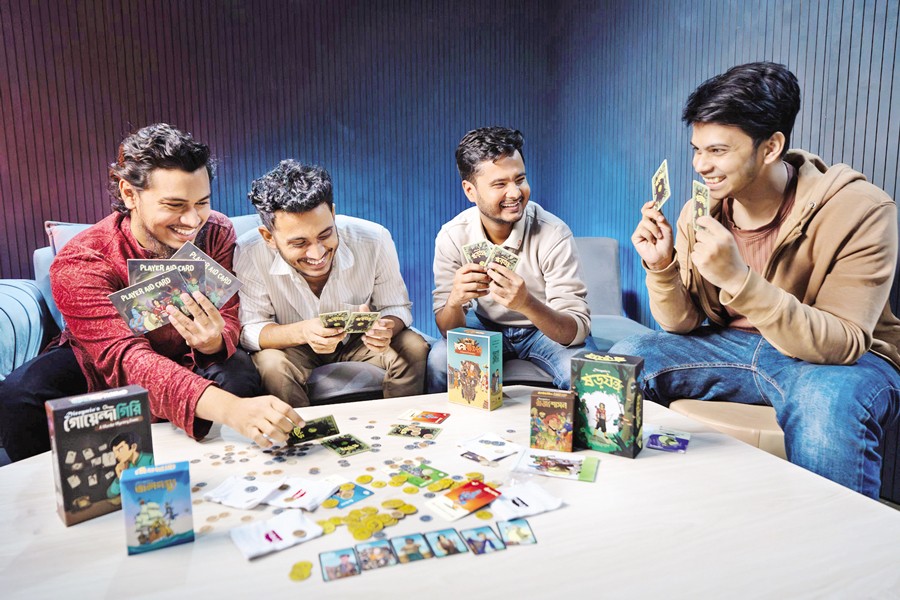 Young people are busy with modern local board games.