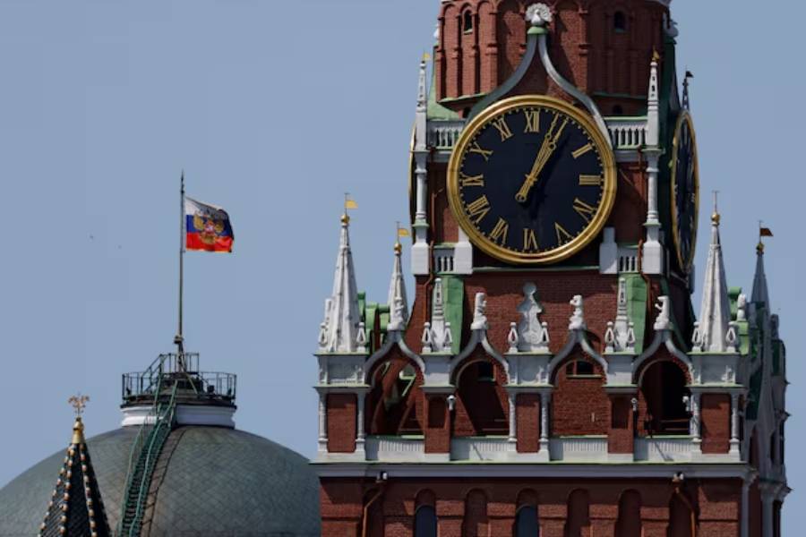 The Russian flag flies on the dome of the Kremlin Senate building behind Spasskaya Tower in Moscow, Russia June 2, 2025.