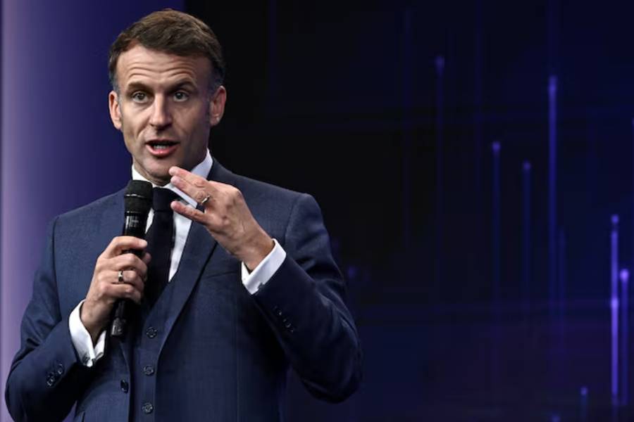 France's President Emmanuel Macron gestures as he speaks during the opening of the "Adopt AI" international summit on artificial intelligence, at the Grand Palais in Paris, France November 25, 2025.