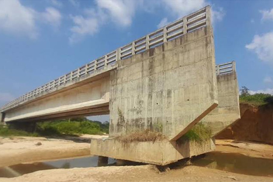 Photo shows the incomplete bridge over the Chhora River in Madhabpur Upazila of Habiganj. - FE Photo