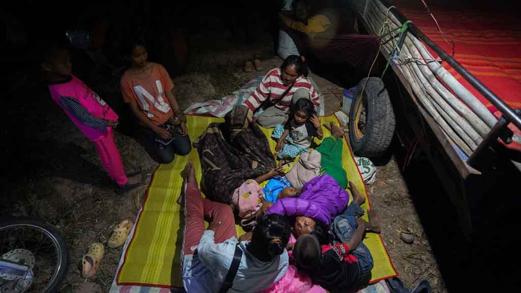 People gather inside a temporary shelter amid deadly clashes between Thailand and Cambodia along a disputed border area at Chroy Neang Ngourn Pagoda, in Siem Reap, Cambodia, Dec 8, 2025. REUTERS