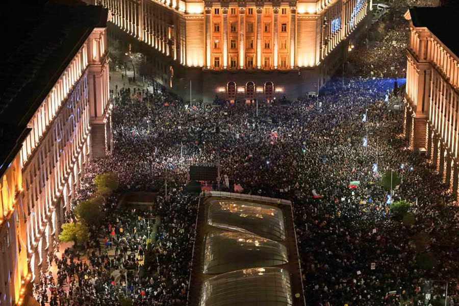A drone view shows protesters demonstrating outside the parliament during an anti-government rally, in Sofia, Bulgaria, Dec 10, 2025.