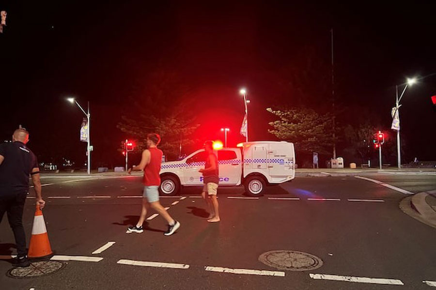People walk at the scene of a shooting incident at Bondi Beach, Sydney, Australia, December 14, 2025.